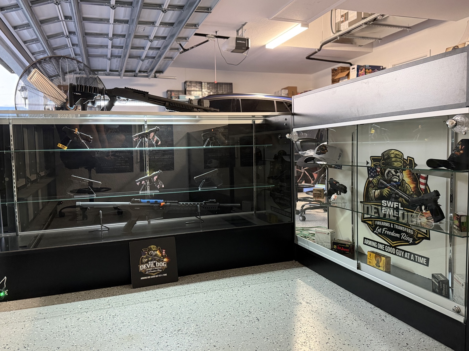Display case featuring handguns and rifles
